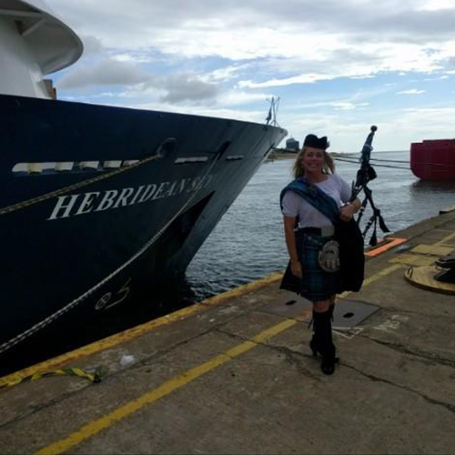 bow of a ship with a piper