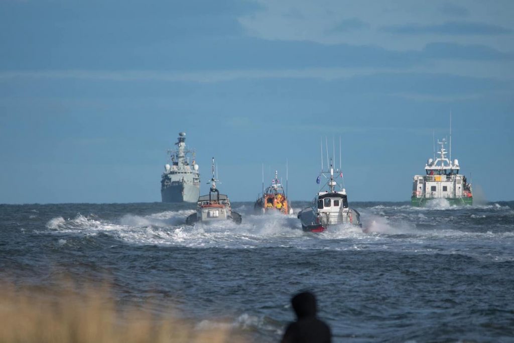 Montrose Port pilots boats and the RNLI Montrose lifeboat going to greet HMS Montrose