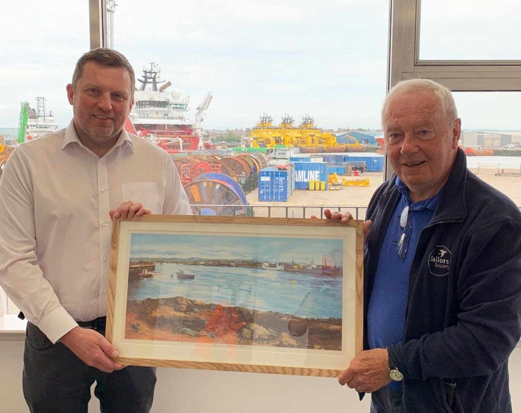 Montrose Port Harbour Master, Ross Marshall, presenting port chaplain, Peter Donald, with a framed artwork on his retirement