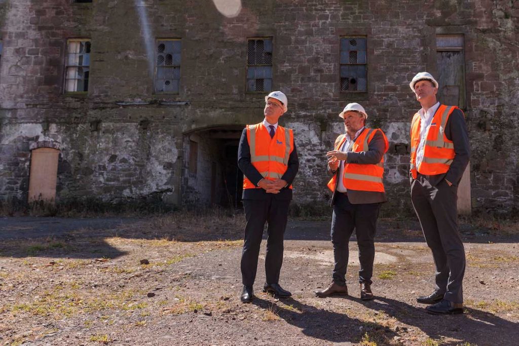Scotland's First Minisiter John Swinney and Dave Doogan MP being shown the Customs House regeneration project at Montrose Port by CEO Tom Hutchison