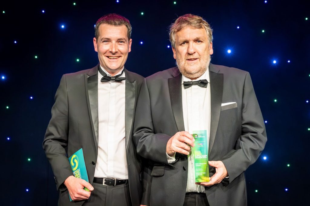 Andrew Wilson, offshore general manager of Coast Offshore with Tom Hutchison, CEO of Montrose Port who is holding the award for Best Practice at the Scottish Green Energy Supply Chain Awards 2024