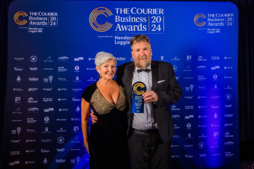 Montrose Port chief executive, Tom Hutchison, with wife Fiona at the Courier Business Awards holding the Business of the Year award.